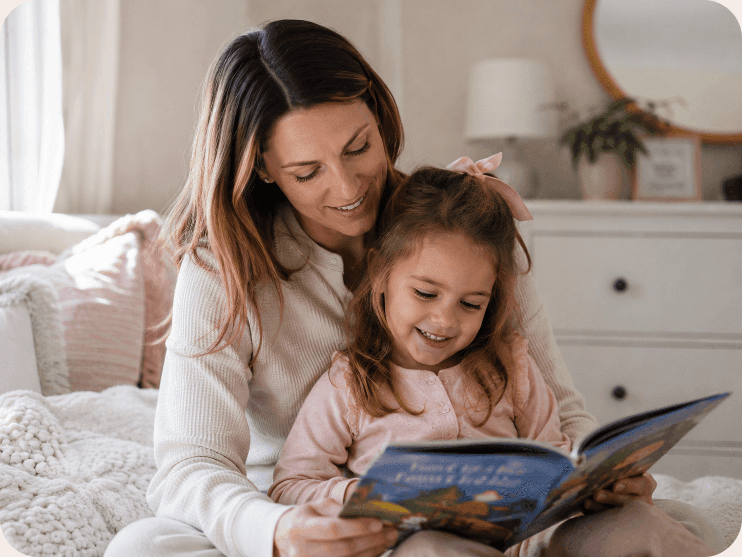 A mother and daughter reading a storybook together
